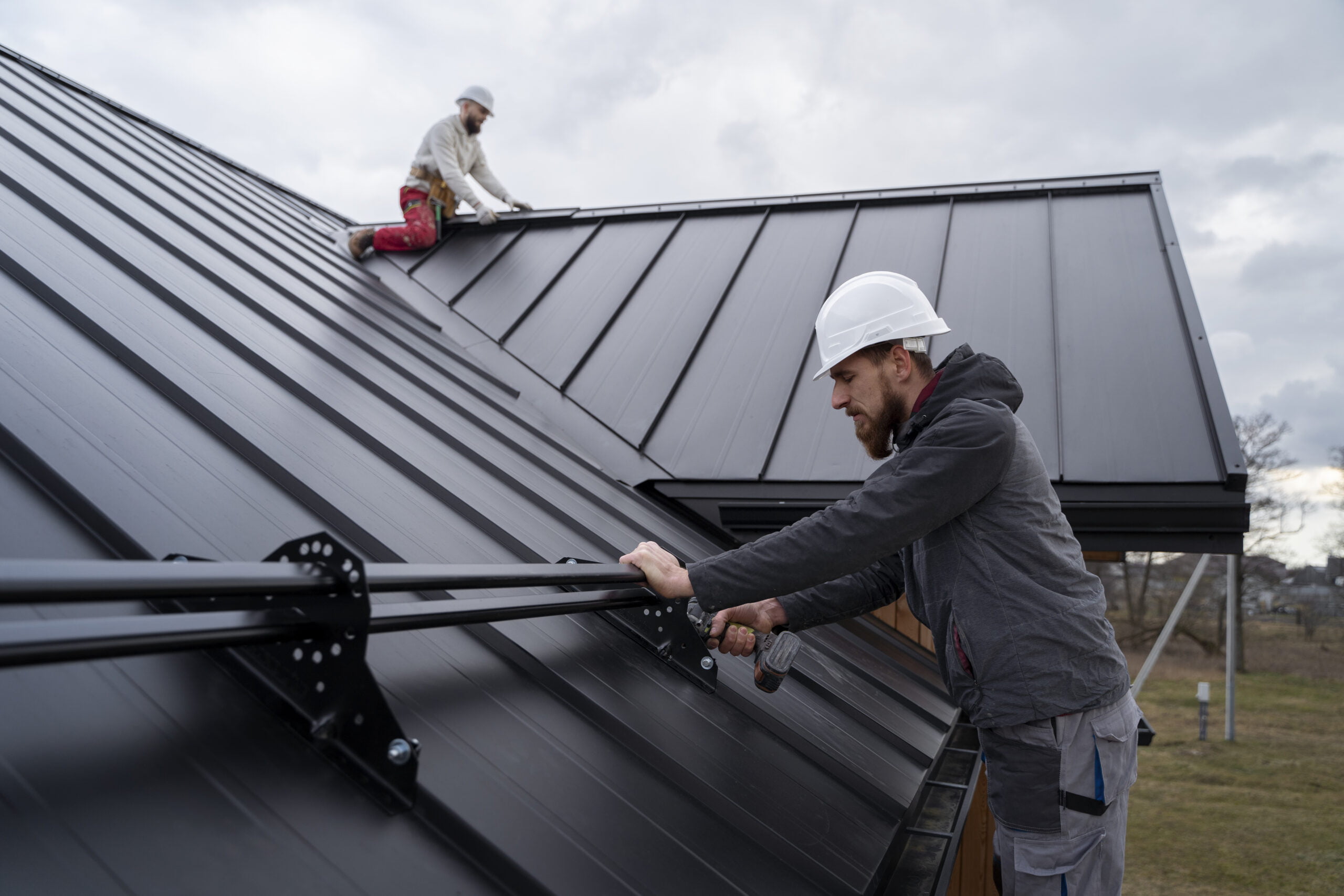 A handyman installs awning