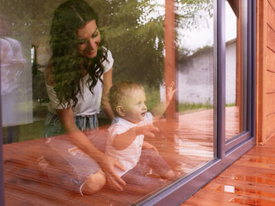 The mother and son looking at the window