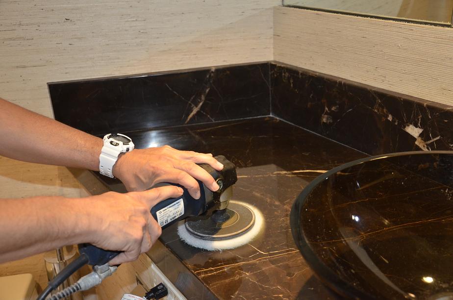 A worker repairs a countertop