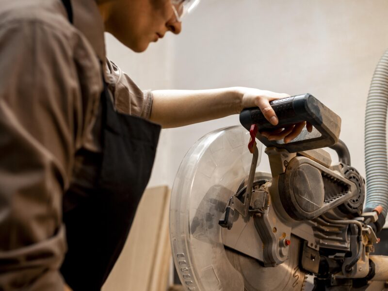 A worker installs a dryer vent