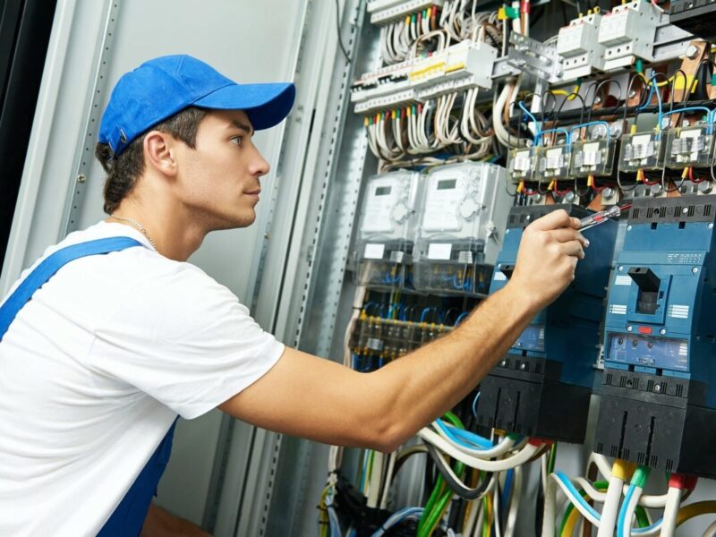 An electrical worker does his job.
