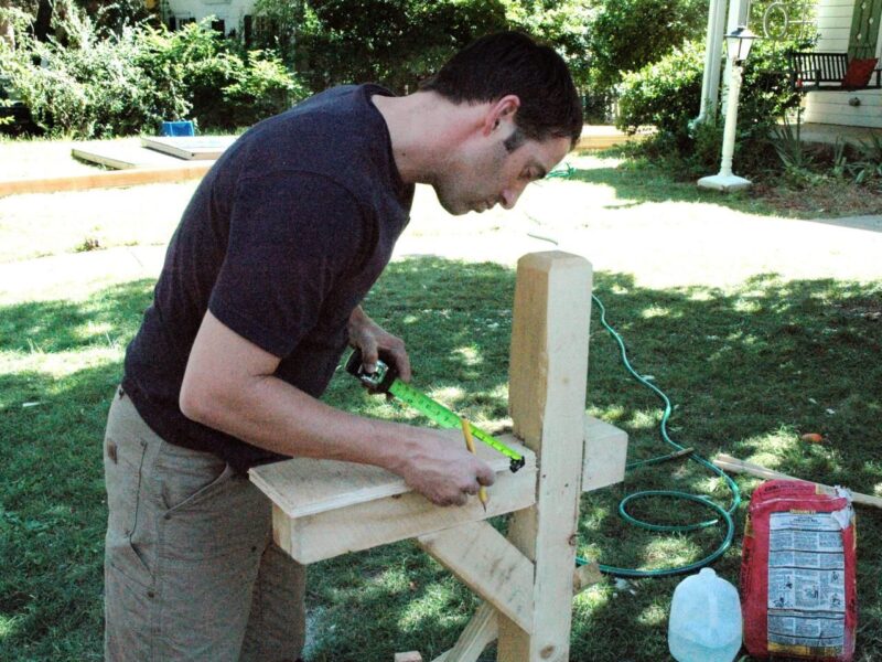 A worker installs a mailbox