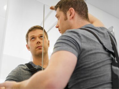 A worker installs a mirror