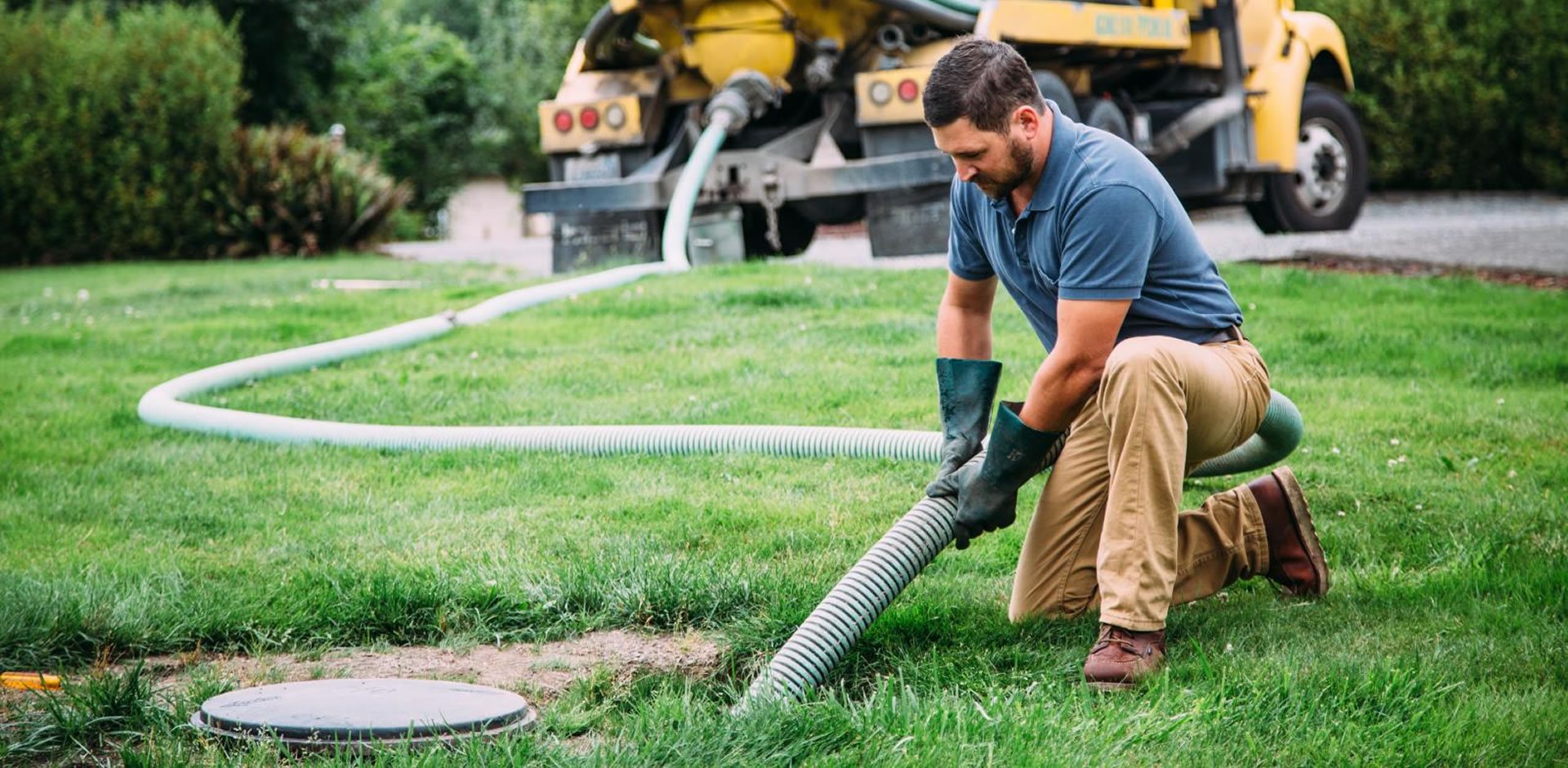 A worker repairs a septic system