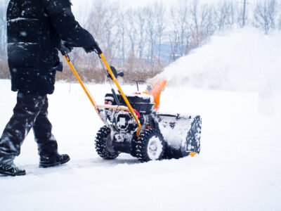 A man cleans snow
