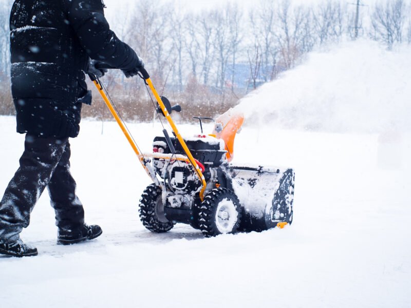 A man cleans snow