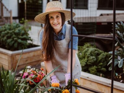 woman gardening with flowers in backyard