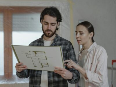a couple discussing about floor plans